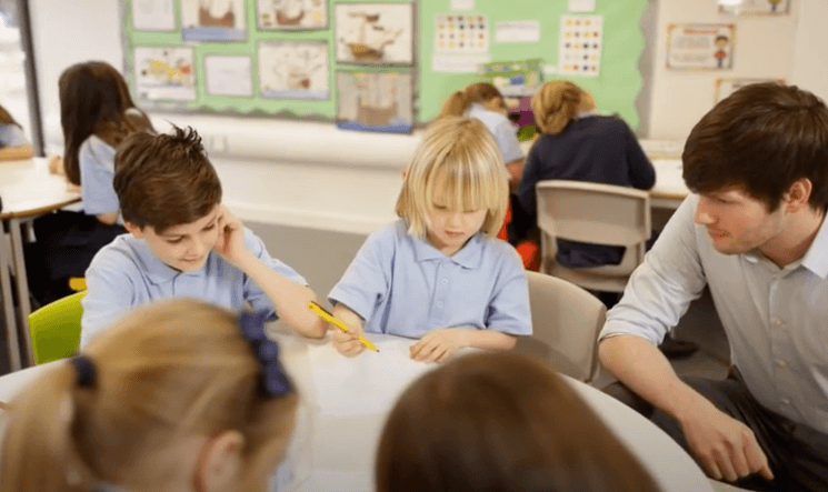 Kids doing group assignment at school